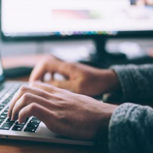 Photo of Person Using Computer (Glenn Carstens-Peters)